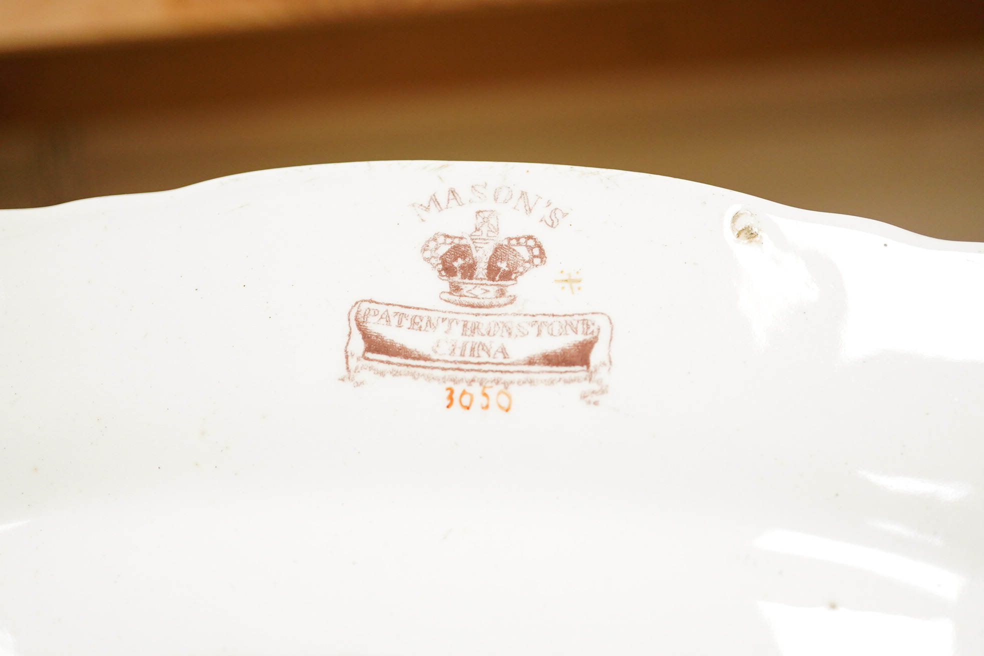 A Belleek porcelain basket, two Masons Ironstone dishes, a pair of Royal Crown Derby Japan pattern dishes and an ironstone leaf shaped dish (6).